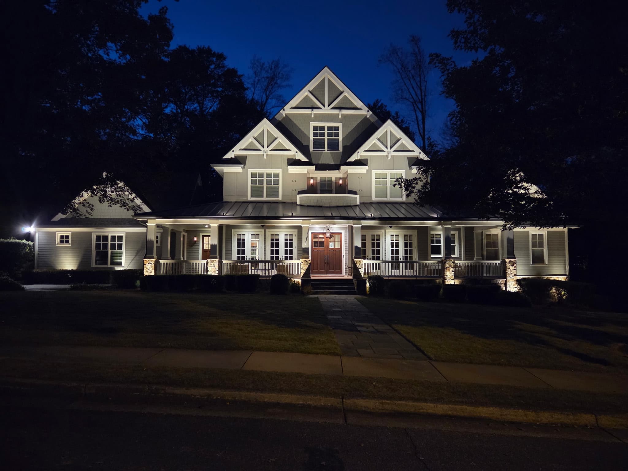 Large estate home in Braselton, GA illuminated with facade and landscape lighting